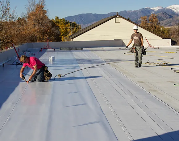 Flat roof installation services in Stoughton MA using durable, energy-efficient materials.